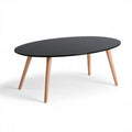 Owalny stolik kawowy 120 x 60 x 45 cm z czarnym blatem MDF i nogami z litego drewna bukowego